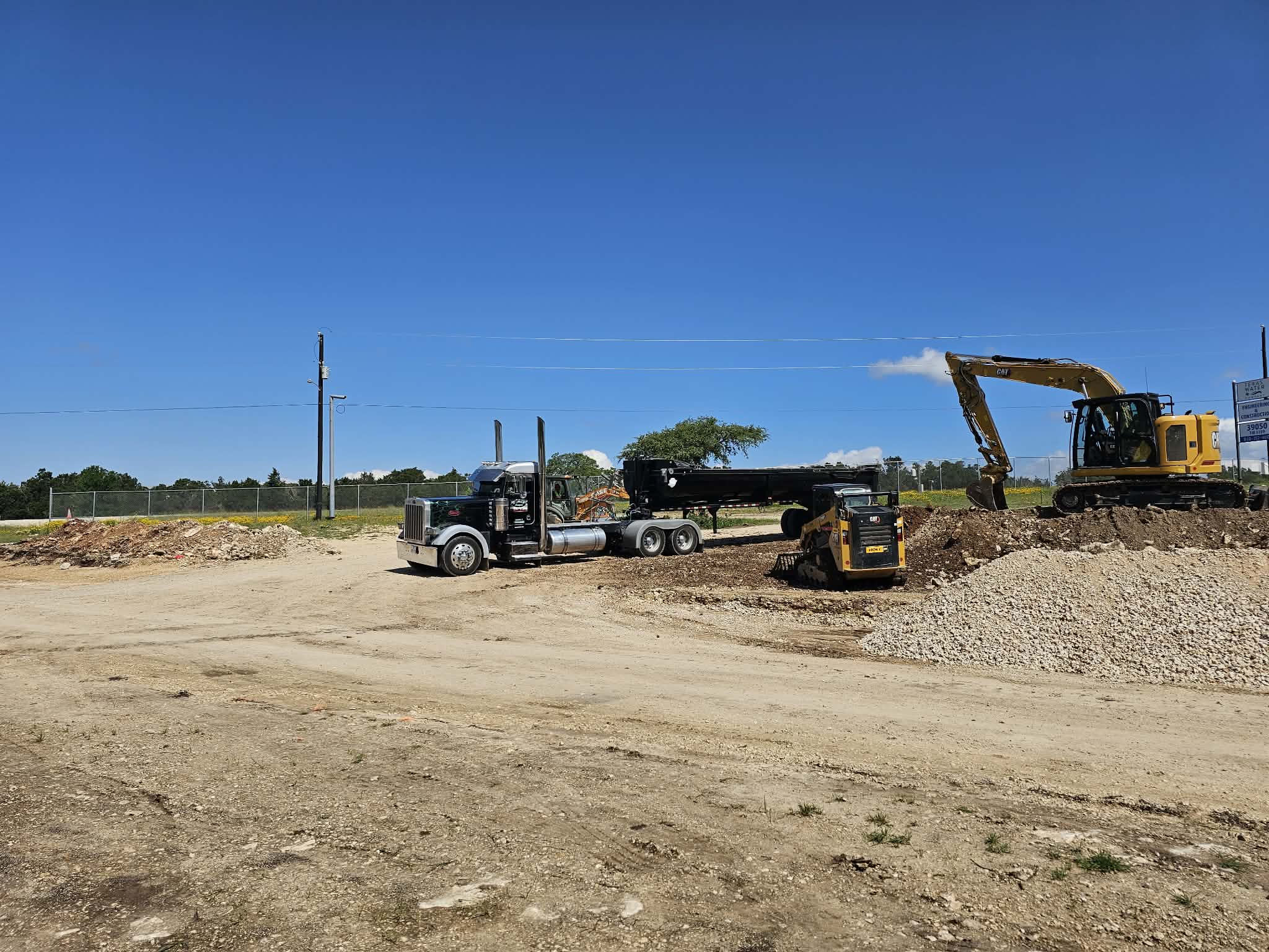 Casias Trucking equipment on a job site